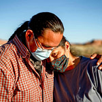 A Navajo husband and wife encourage one another because of the Coronavirus curfew by the Tribal Council in Arizona